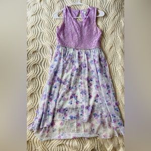 A girls size 16 lavender colored dress, this was only used once for an event.
